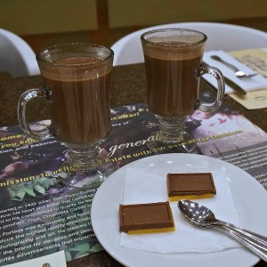 Traditional hot chocolate with chocolate praline square and cheese